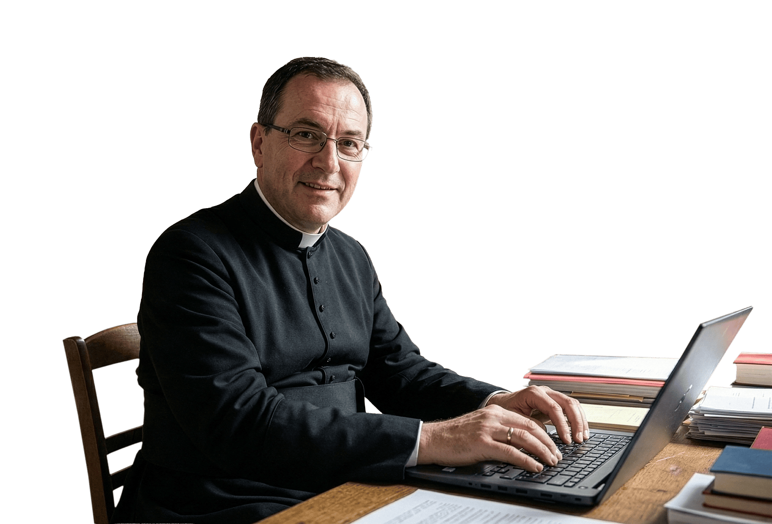 A Catholic priest using a laptop computer